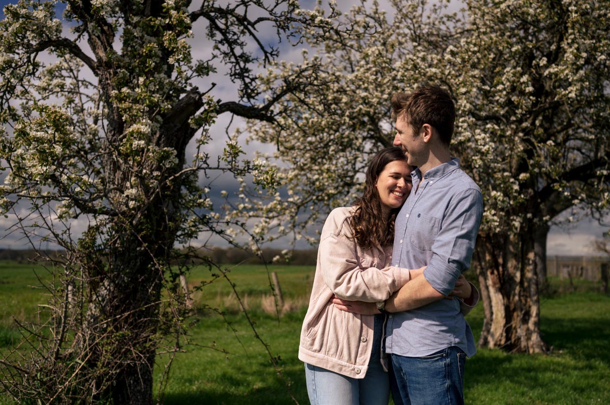 Bllossom trees are the backdrop for Becca and Freds pre wedding photoshoot