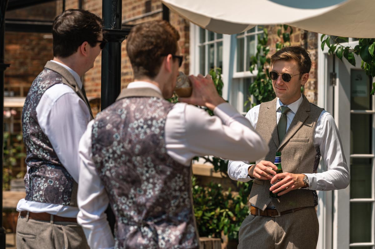 Fred and Becca wedding at the secret garden in kent. Photo of fred and his best men