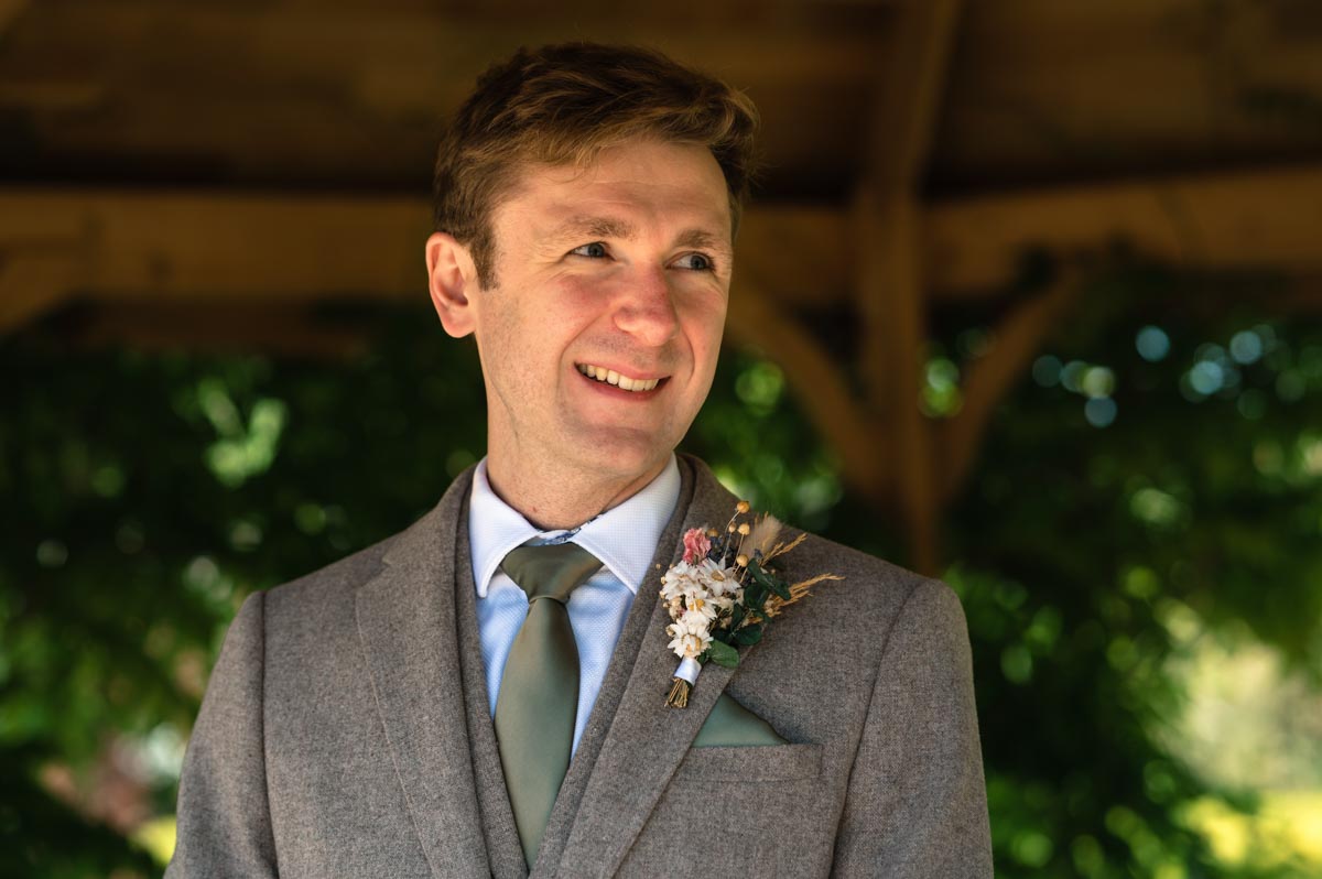 photograph of fred at his secret garden wedding in kent under the gazebo