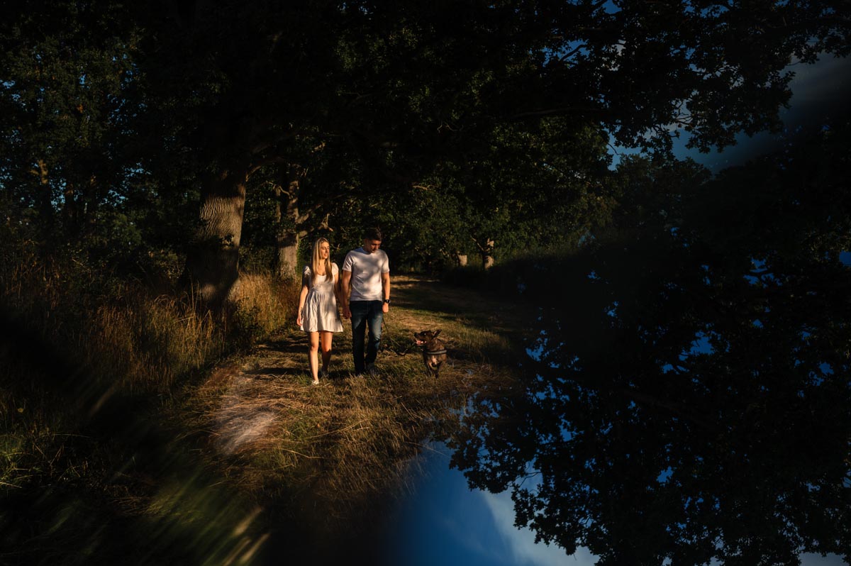 sarah and james walk max their dog during their pre wedding photoshoot in bethersden kent