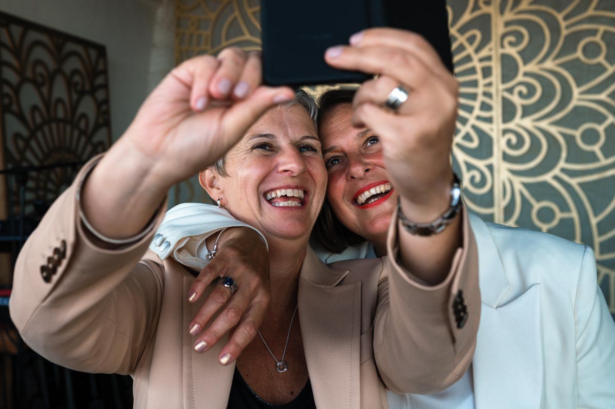 Bride and her friend photographed at same sex wedding In east sussex