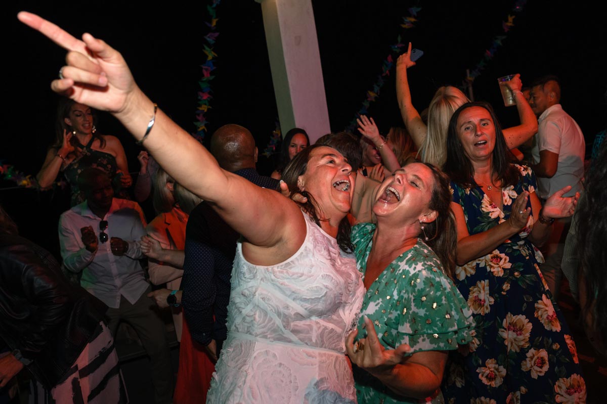 Sharon dancing with friend at her wedding in Brighton