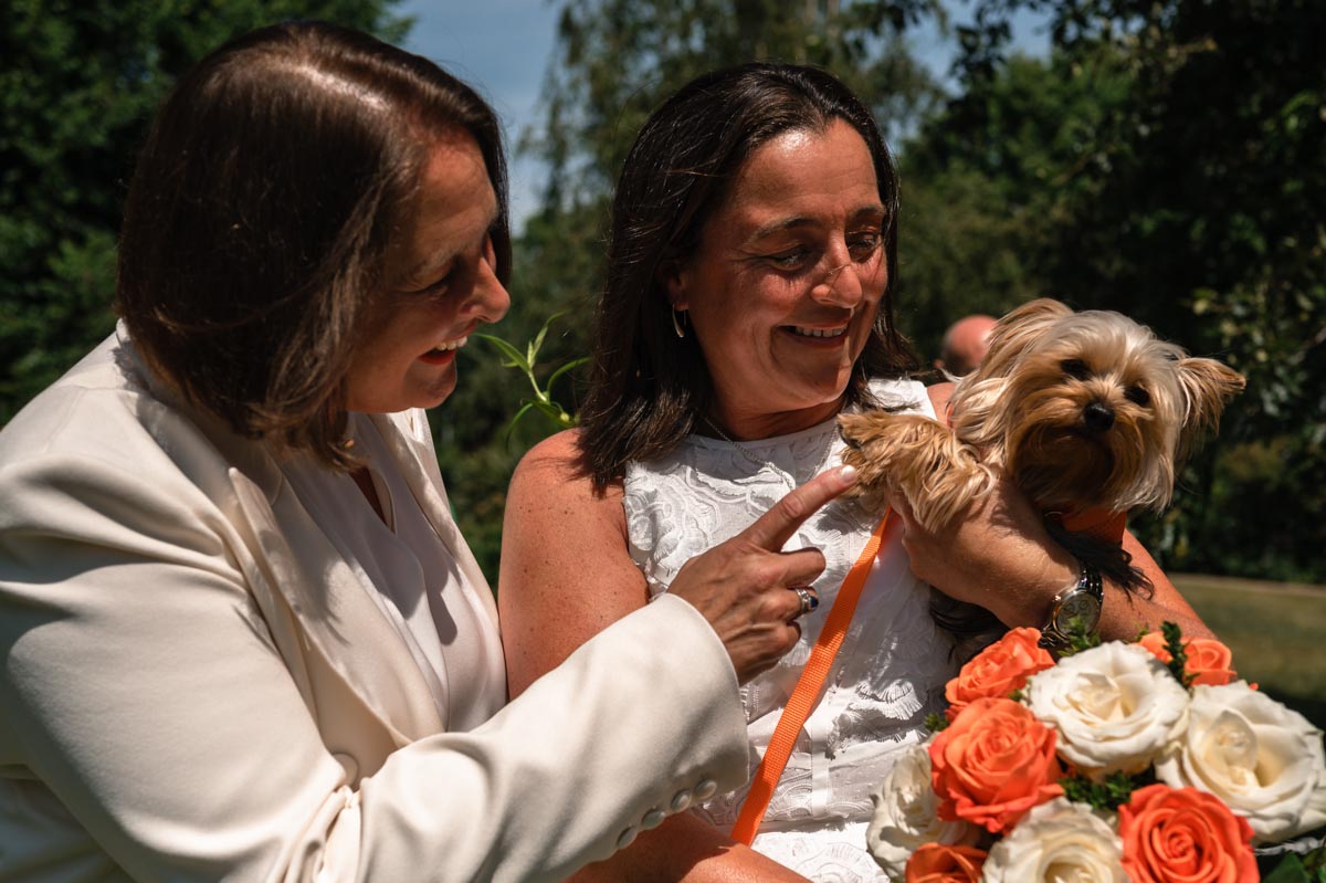 same sex couple and their dog on their wedding day at Brighton Royal Pavillion