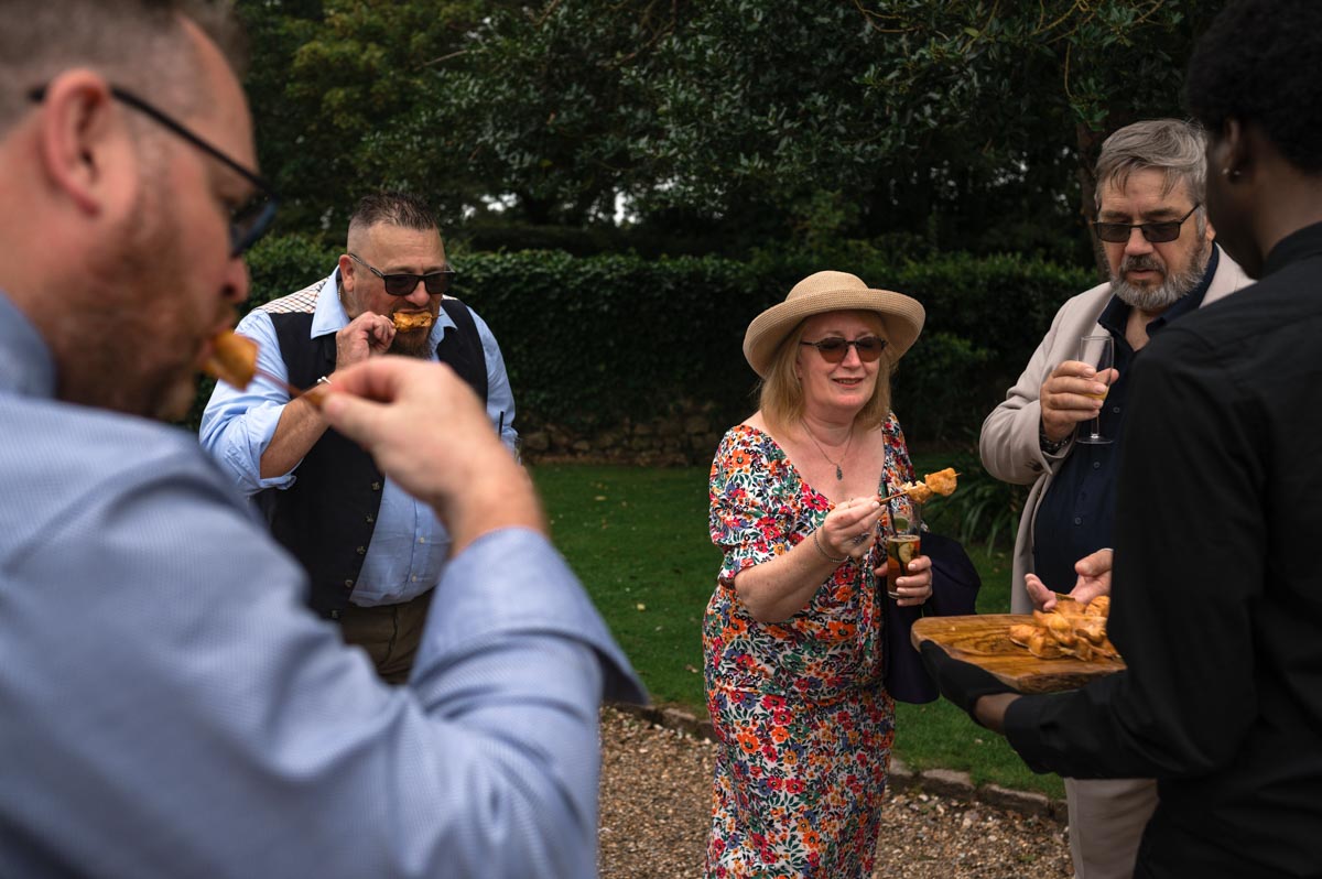 guests enjoy canapes - westenhanger castle wedding photography