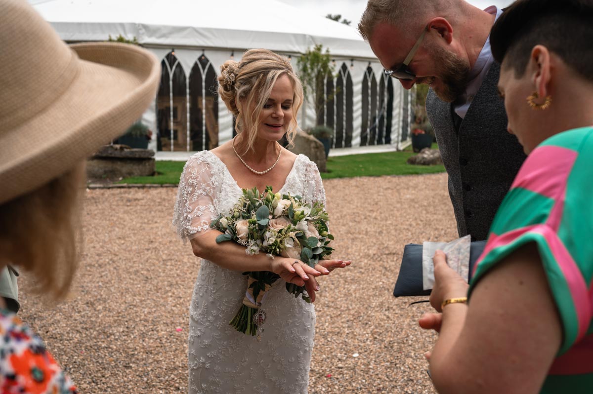 lara shows friends her wedding ring - westenhanger castle wedding photography