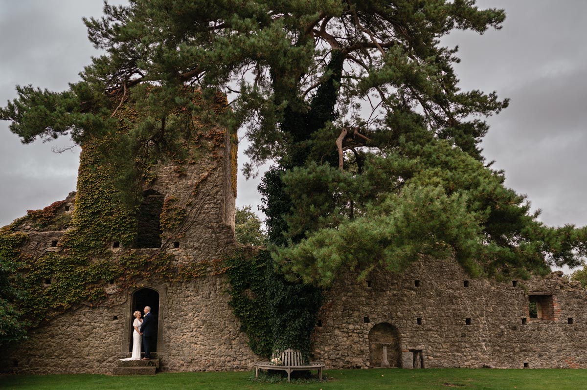 lara and phil photographed in the grounds at westenhnger castle