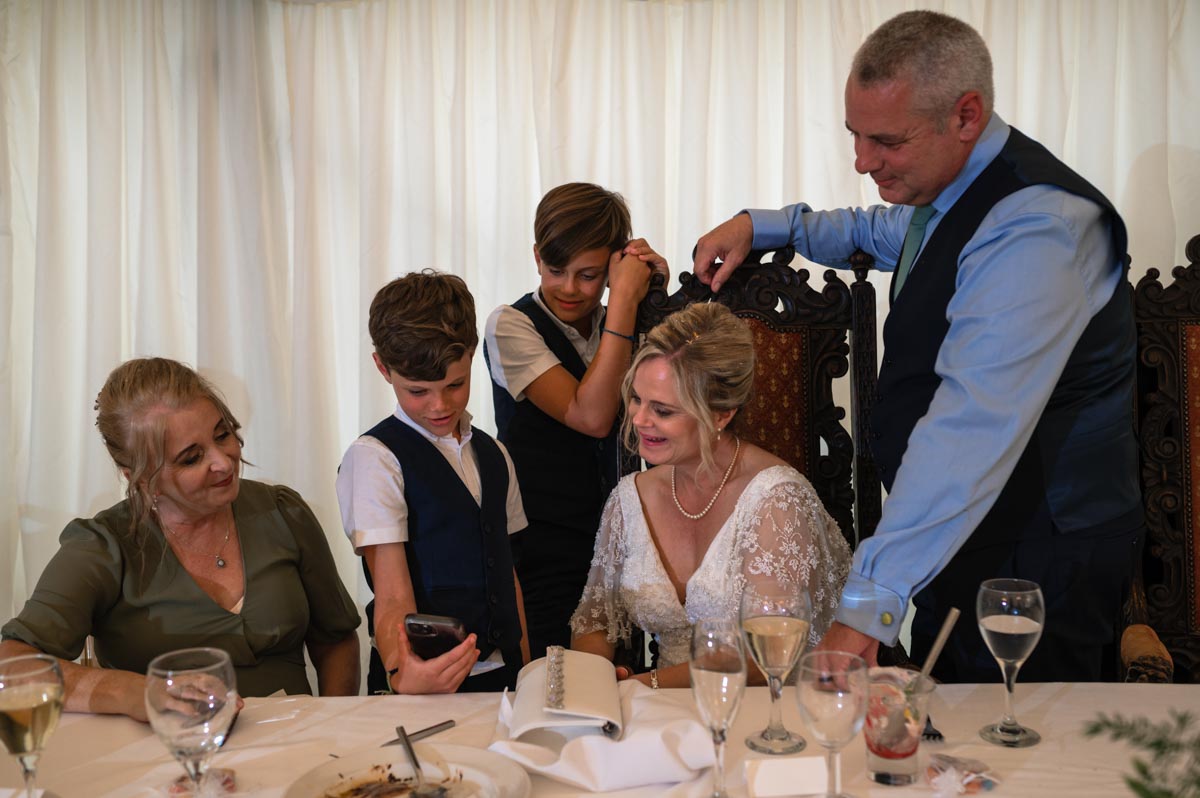 lara and phil with their guests during wedding reception at westenhanger castle