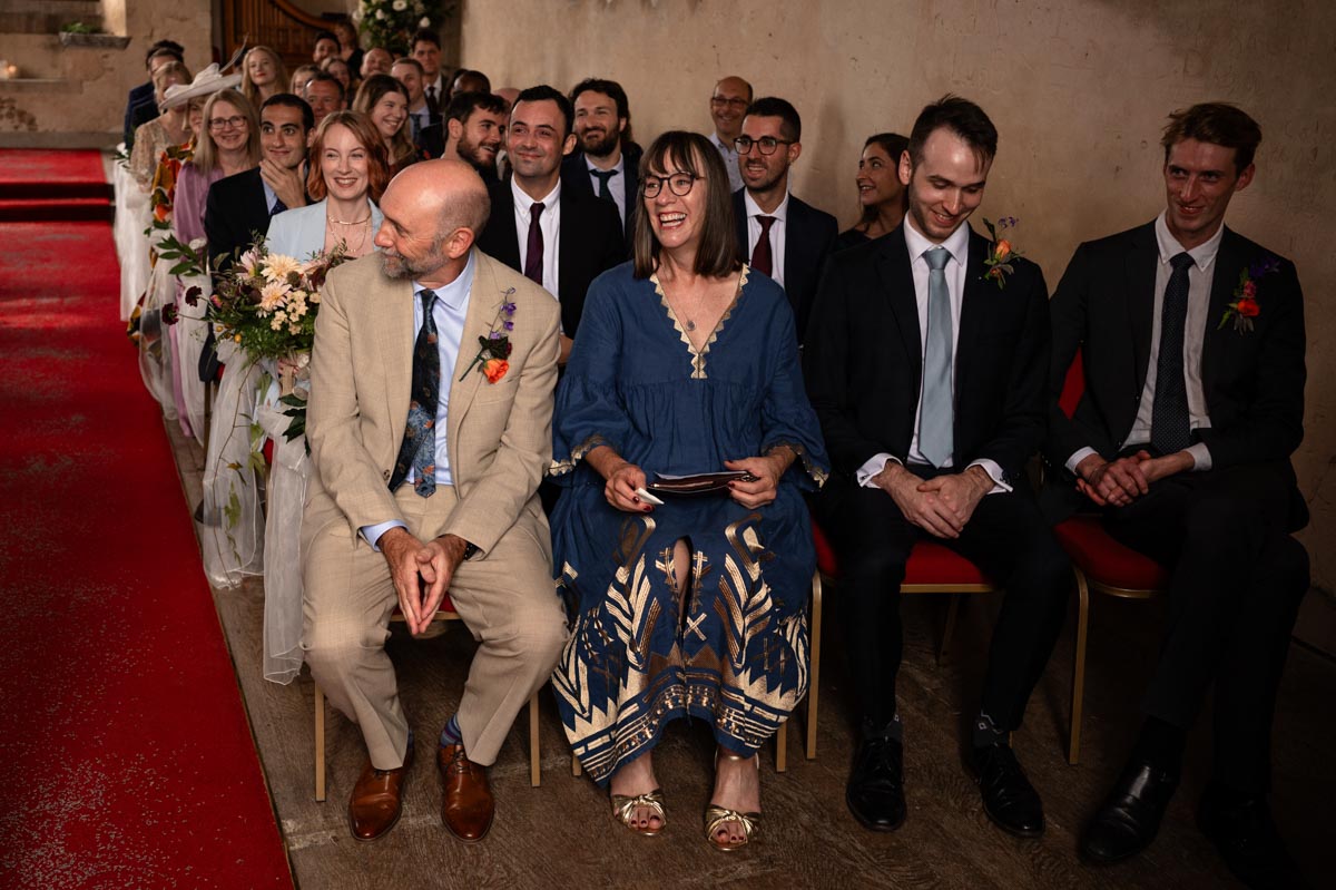 Photograph of wedding guests at Poppy and Pablos wedding at Bilsington Priory in Kent