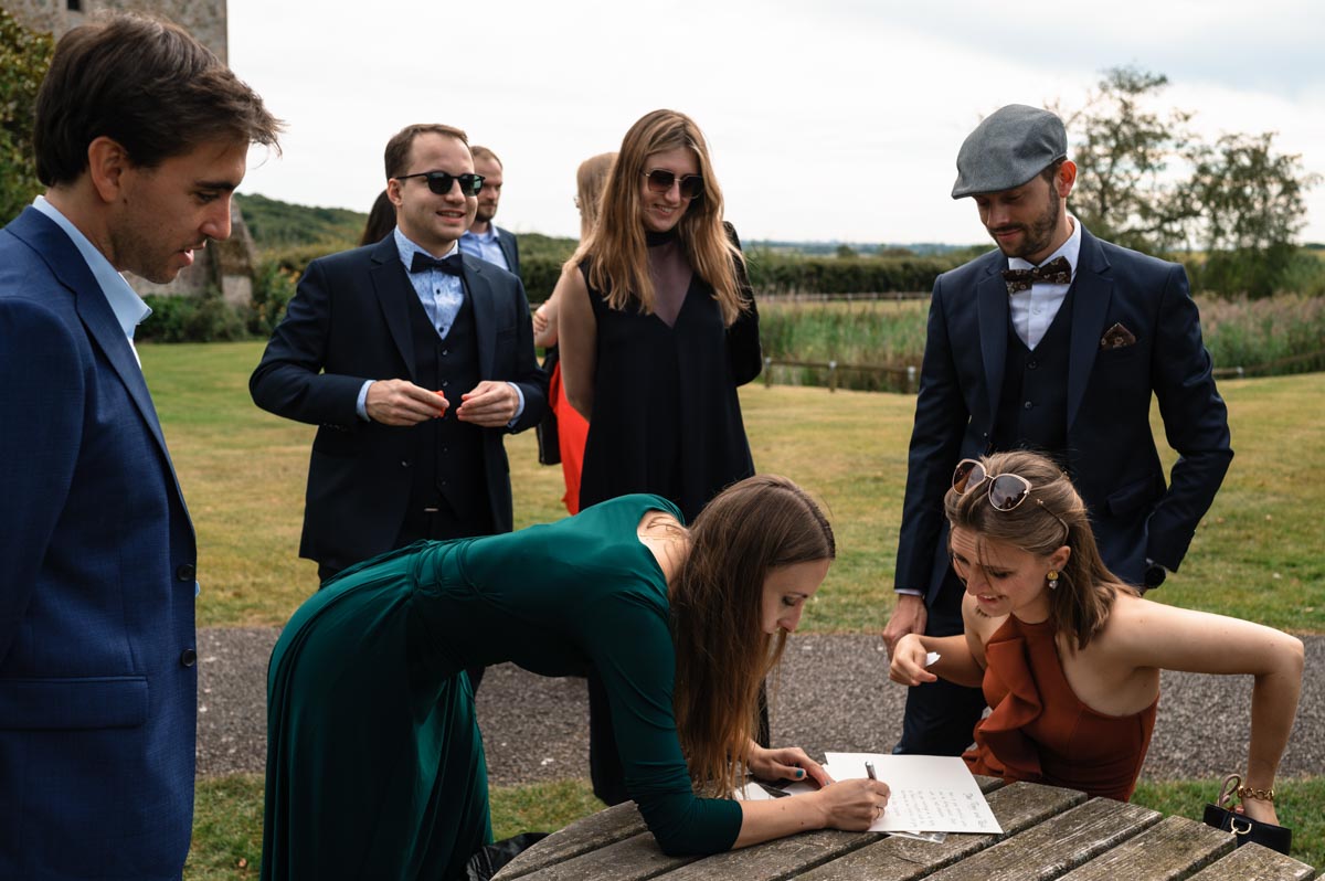 Pablo and Poppys wedding guests outside at Bilsington priory wedding venue in Kent