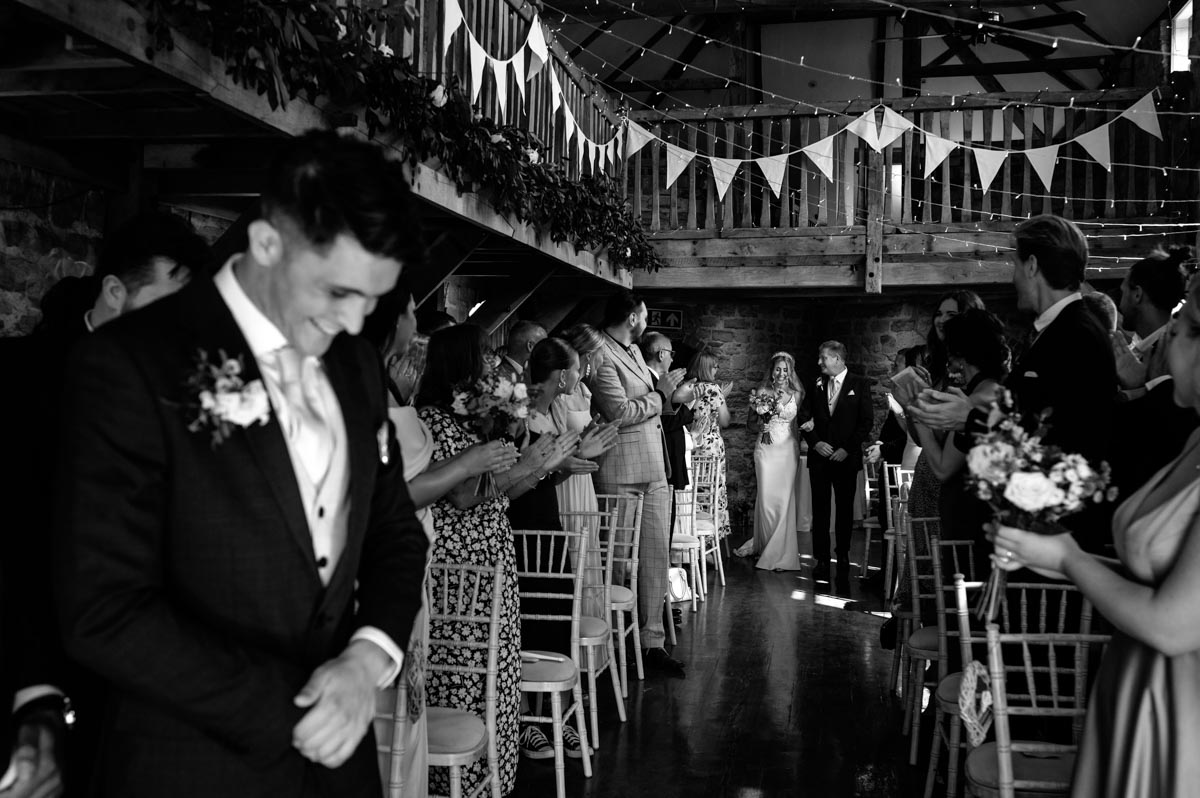 Swallows oast wedding ceremony. James waiting for Sarah to walk down the aisle