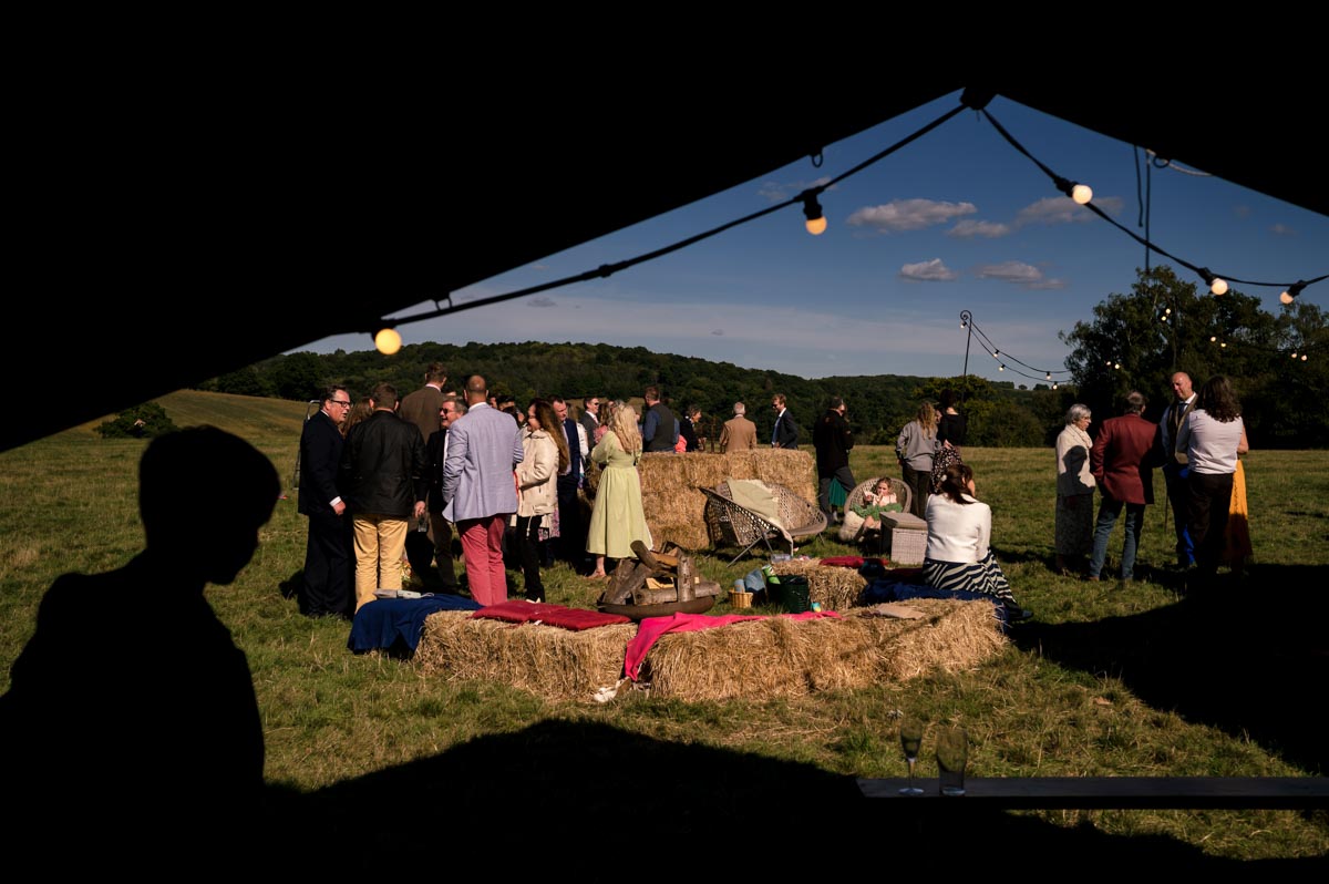Natural wedding photography. Guests enjoy the setting at Sarah and Matthews Little Bayham venue