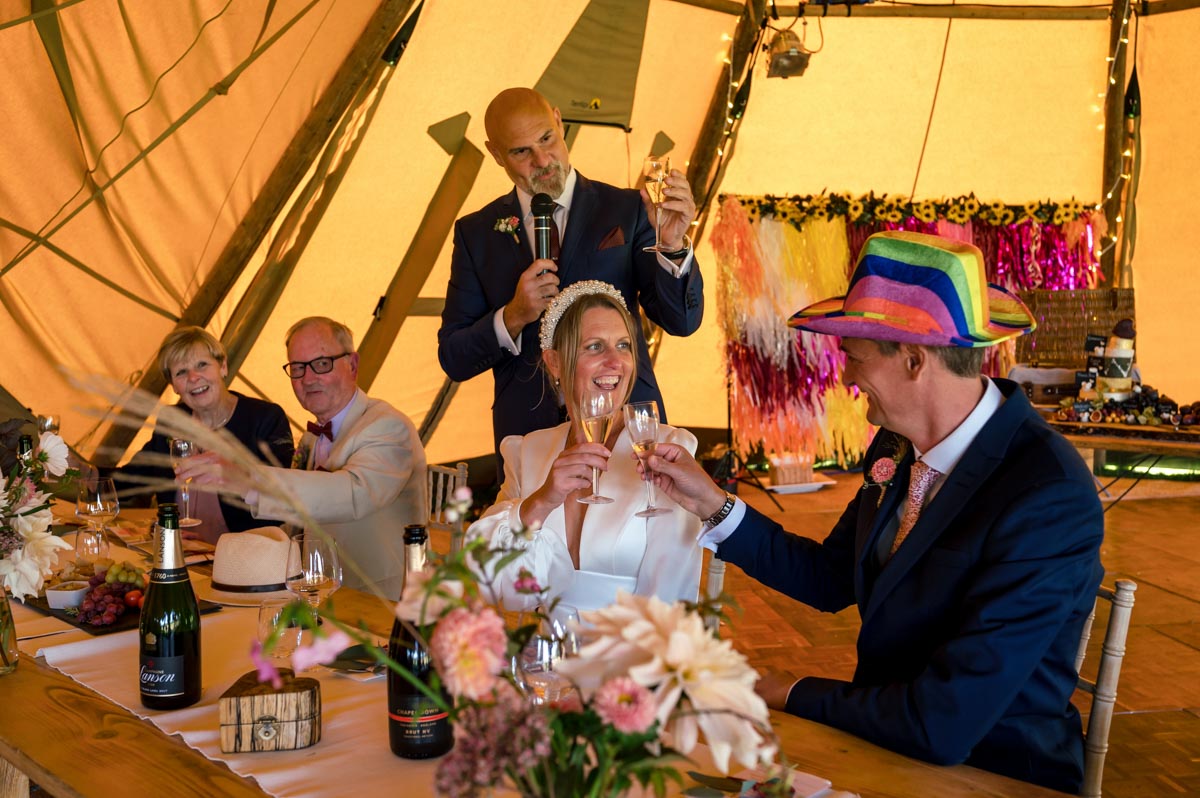 Wedding reception photography. Best man toasts Sarah and Matthew