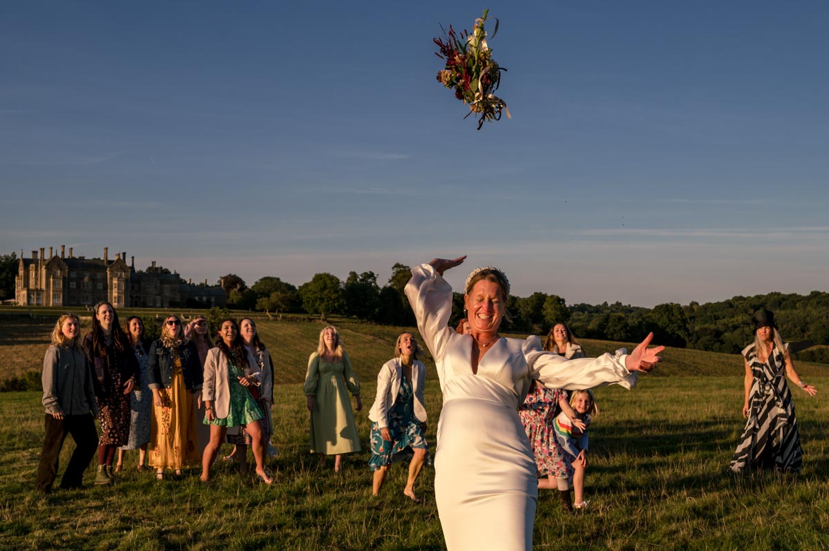 Wedding photography bouquet toss at sarah and Matthews wedding at little bayham