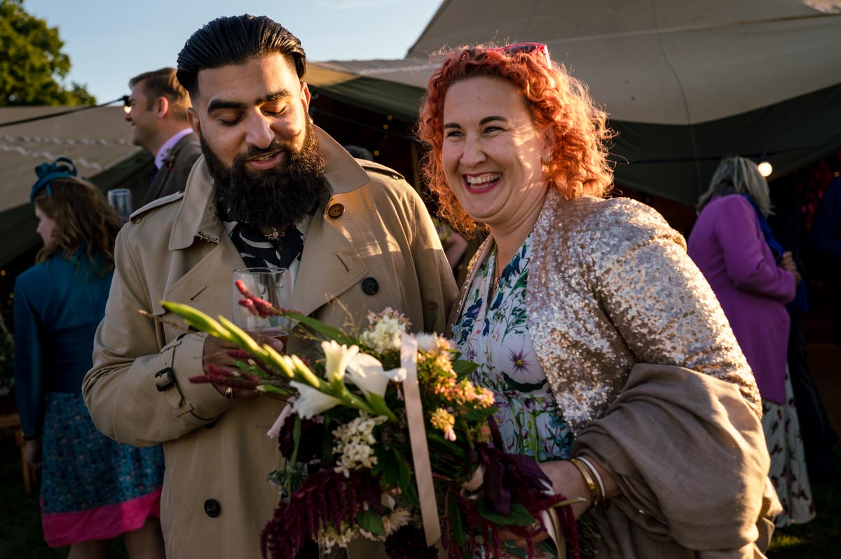Wedding guests photographed at outdoor summer wedding