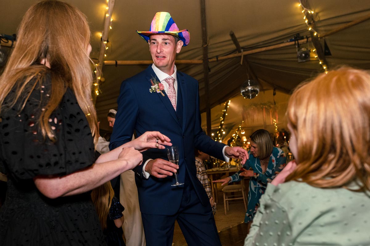 Matthew and wedding guests photographed at the reception