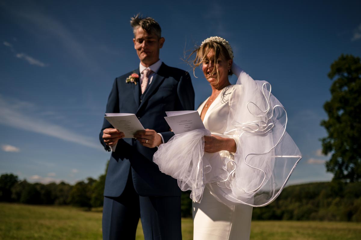 Photograph of Sarah and Matthew singing during their wedding ceremony at Little Bayham.