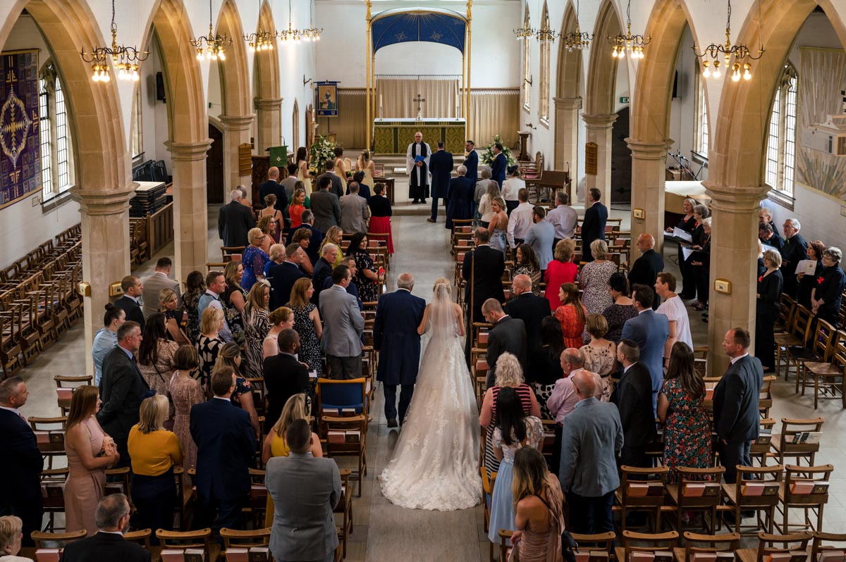 Photograph of dad and bride from above in the church