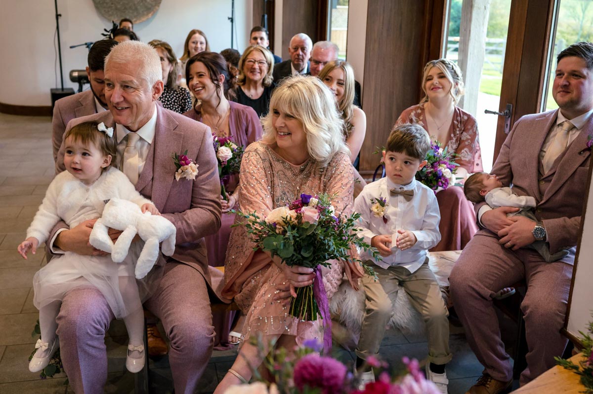 How I approach photographing your wedding ceremony, including guests