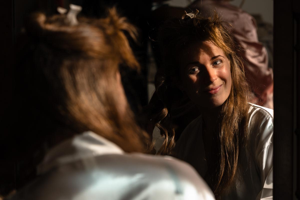 bridesmaid getting ready for Paige and davids wedding at Westenhanger castle in Kent