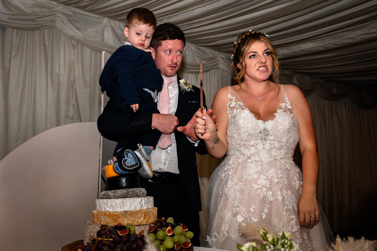 westenhanger castle wedding photography. cake cutting