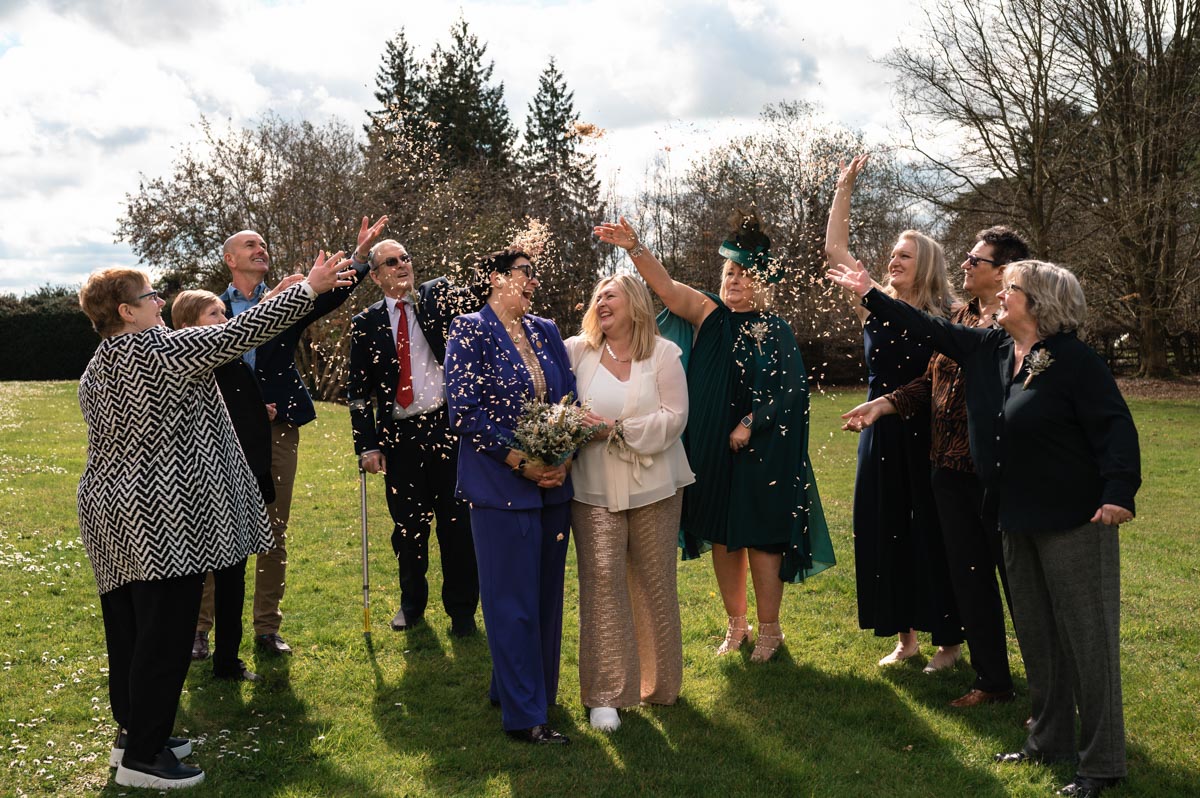 why I love photographing small weddings. Marta and Emma with their guests during the confetti throw