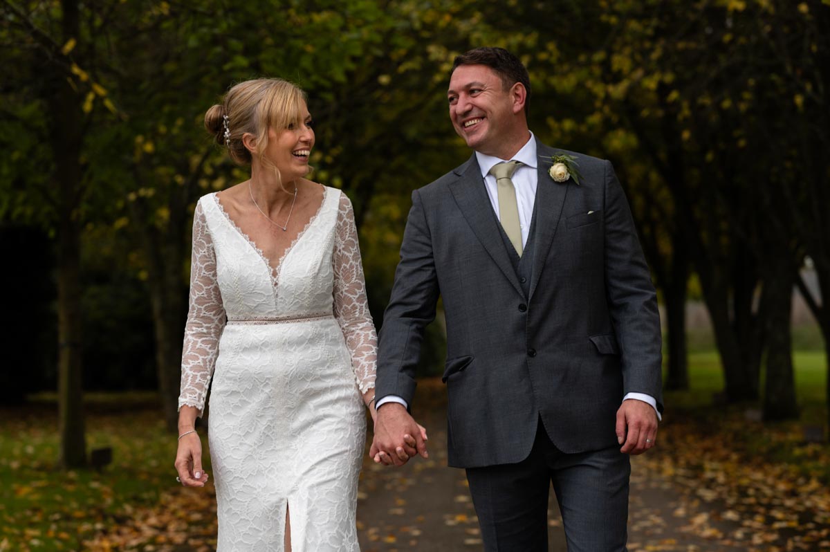 Wedding photography at Chilston Park Hotel. Dane and James walking together