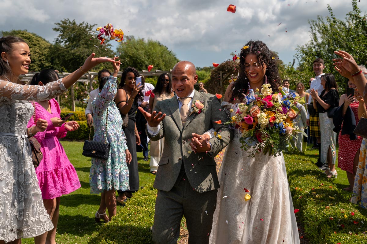 The secret garden wedding venue in Kent. Elanna and Piyaroe's confetti throw.