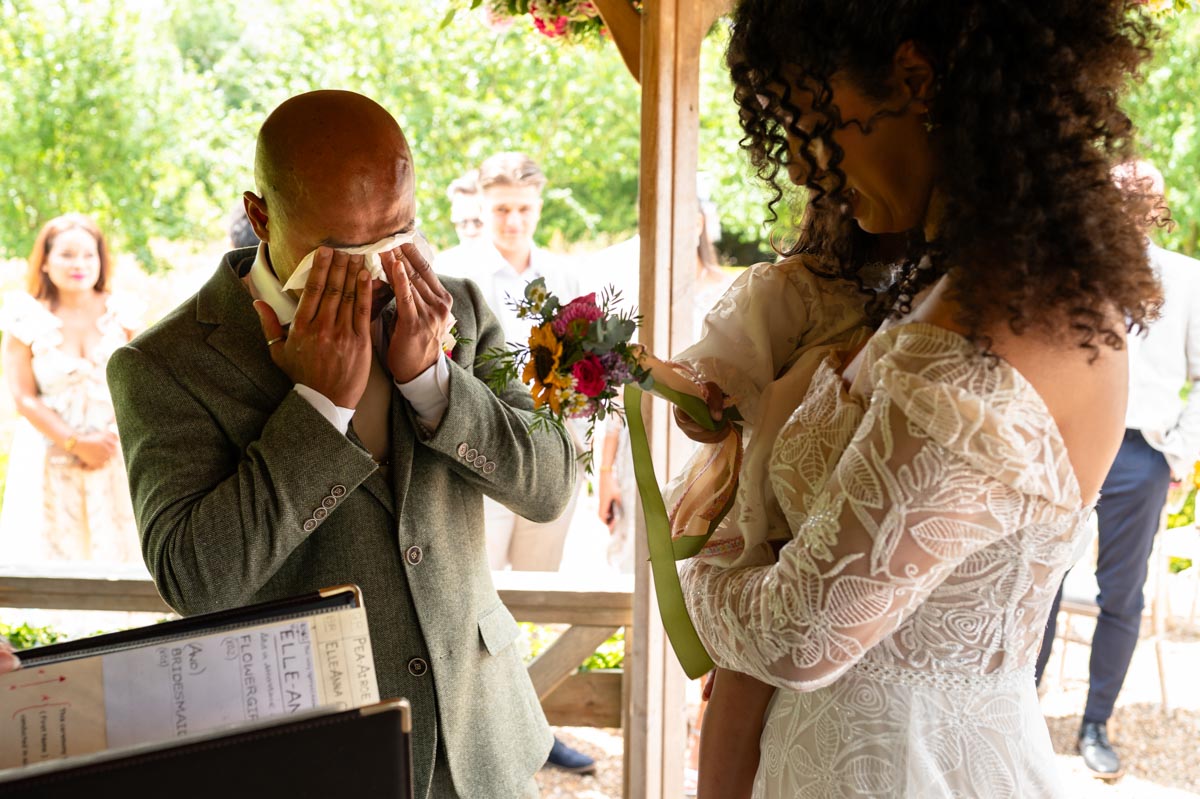 Elanna and Piyaroe photographed during wedding ceremony at The Secret Garden in Kent